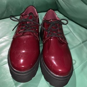 Faux patent leather burgundy platform shoes. NWOT